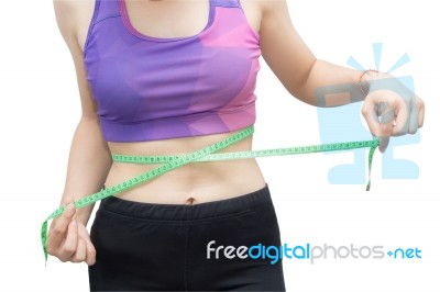 Woman In Sport Bra Measuring Her Body With Tape Isolated On Whit… Stock Photo