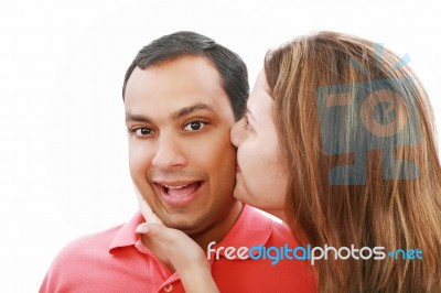 Woman Kissing Her Boyfriend Stock Photo