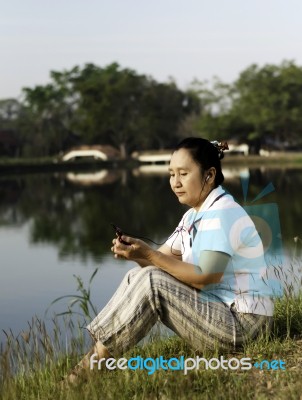Woman Listening To Mp3 Stock Photo Woman Listening To Mp3 Stock Photo