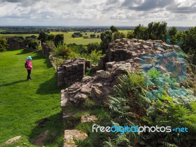 Woman Looking At Ancient Ruins Of Beeston Castle Stock Photo