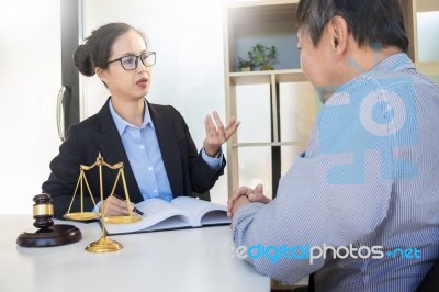 Woman Meeting Notary For Advice A Lawyer With Documents Discussi… Stock Photo