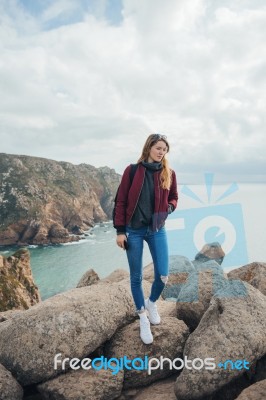 Woman On A Rock Near Cabo Da Roca In Portugal Stock Photo