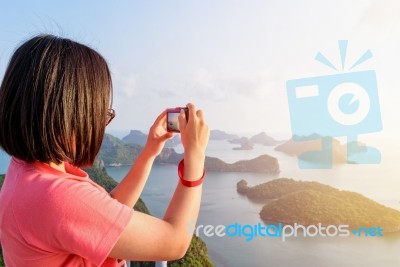 Woman On Peak Take Photos Stock Photo