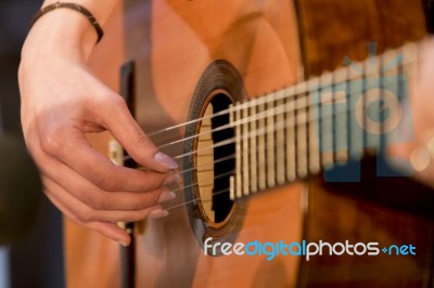 Woman Plays Guitar Stock Photo