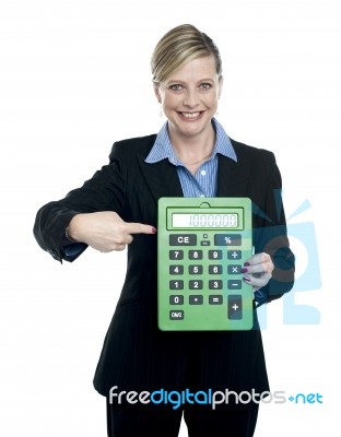 Woman Pointing Calculator Stock Photo