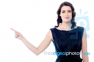 Woman Pointing Up With Forefinger Stock Photo