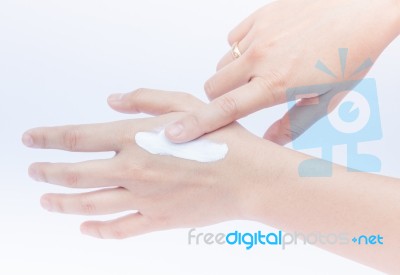 Woman Pouring Body Lotion On Hand Stock Photo