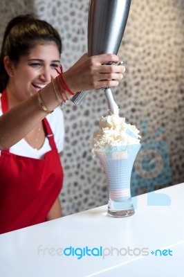 Woman Preparing Thick Shake Stock Photo