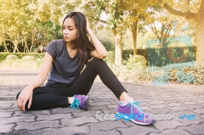 Woman Relaxing After Sports. Hipster Student In The City Park Stock Photo