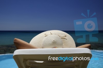 Woman Resting Over The Sea Stock Photo