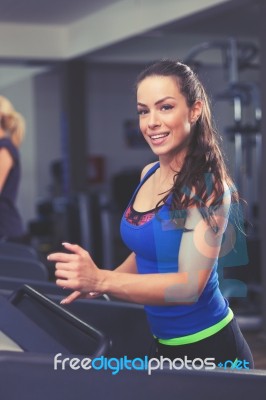 Woman Running On Treadmill Stock Photo