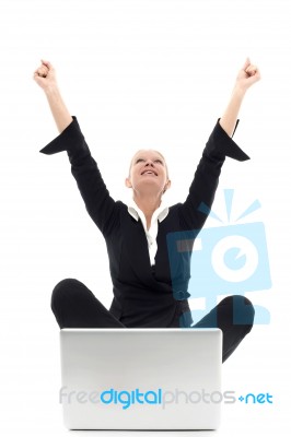 Woman Sat At A Laptop Stock Photo