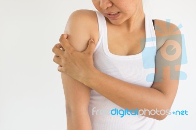 Woman Scratch Her Arm From The Itch Or Woman Suffering From Arm Pain,woman Healthcare Concept And Ideas Stock Photo