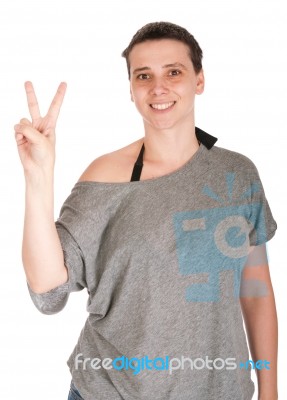 Woman Showing Victory Sign Stock Photo