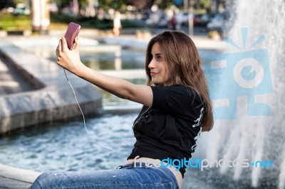 Woman Sitting And Making Selfie Stock Photo Woman Sitting And Making Selfie Stock Photo