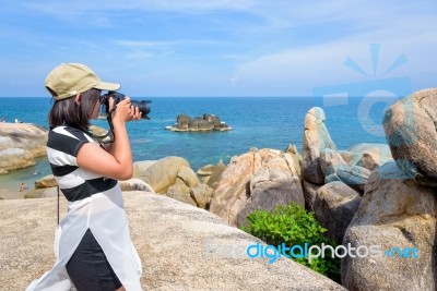 Woman Taking Photos At The Hin Ta Hin Yai Stock Photo