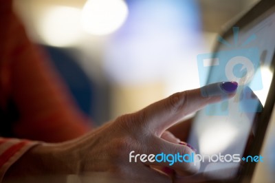Woman Tapping On Tablet Stock Photo