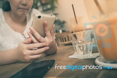 Woman Using Phone In Cafe Stock Photo Woman Using Phone In Cafe Stock Photo