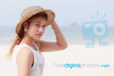 Woman Wear Hat On Beach Stock Photo