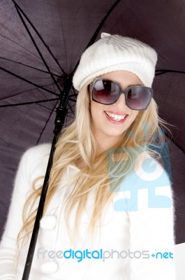 Woman Wearing Cap With Umbrella Stock Photo