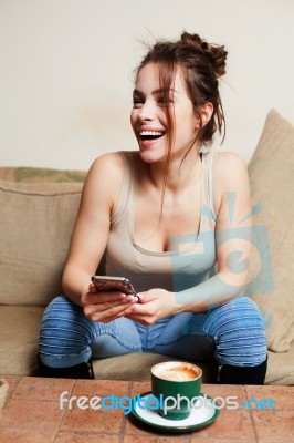 Woman With Coffee Cup On Ceramic Table And Mobile Phone Stock Photo