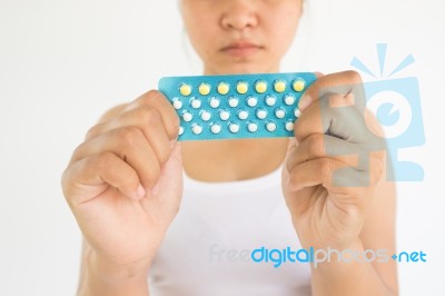 Woman With Combined Pills In Hands,woman Healthcare Concept And Ideas Stock Photo
