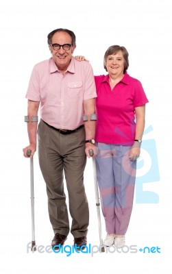 Woman With Her Handicapped Husband Stock Photo