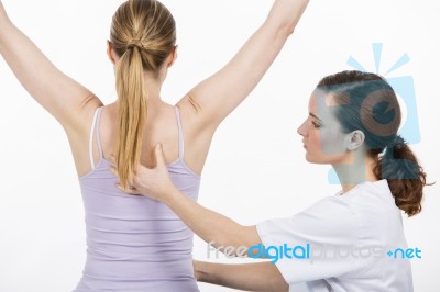 Woman With Physiotherapist Stock Photo