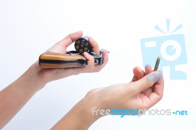 Woman's Hand With A Gun Isolated On White Background Stock Photo