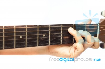 Woman's Hands Playing Acoustic Guitar Stock Photo