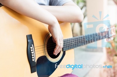 Woman's Hands With Acoustic Guitar In Relax Post Stock Photo