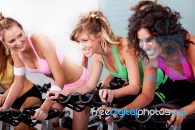 Women At The Gym Doing Cardio Exercises Stock Photo