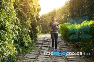 Women Runners Sprinting Outdoors. Sportive People In Public Park… Stock Photo