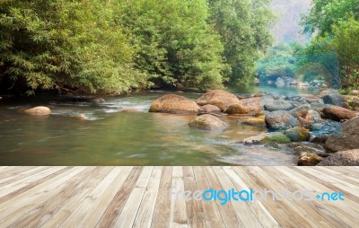 Wood Table And River And Stone With Tree In Forest Beautiful Nat… Stock Photo