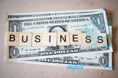 Wooden Block Word Business And Dollar Banknote Stock Photo