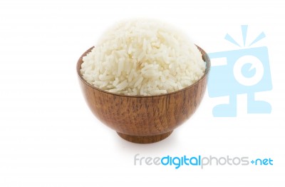 Wooden Bowl Full Of Jasmine Rice On White Background. Thai Rice Stock Photo