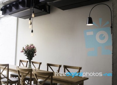Wooden Dining Table In Coffee Shop Stock Photo