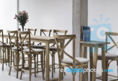 Wooden Dining Table In Coffee Shop Stock Photo
