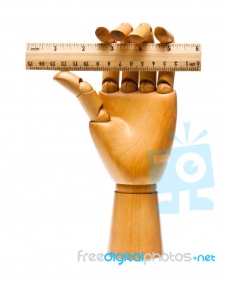 Wooden Hand And Ruler Stock Photo