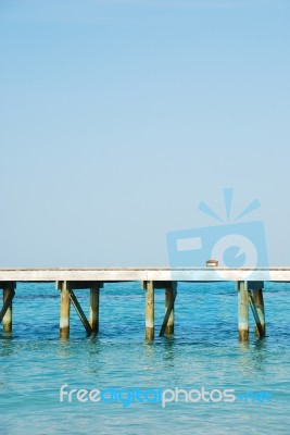 Wooden Jetty Bridge On A Beautiful Maldivian Beach Stock Photo