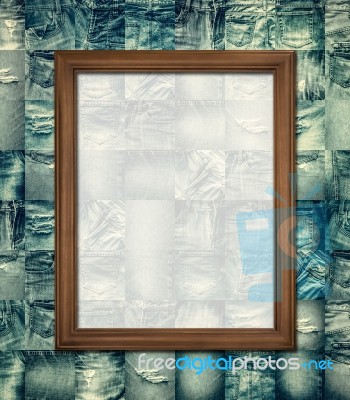 Wooden Picture Frame On Collage Jeans Stock Photo