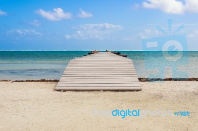 Wooden Pier Dock And Ocean View At Caye Caulker Belize Caribbean… Stock Photo