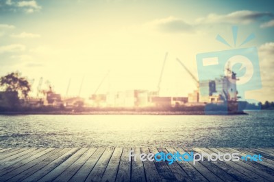 Wooden Pier With Shipping Port Stock Photo