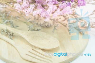 Wooden Set Of Food Utensil And Static Flower Stock Photo
