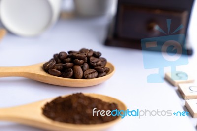 Wooden Spoons Filled With Coffee Bean And Crushed Ground Coffee Stock Photo