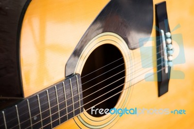 Wooden Yellow Classic Acoustic Guitar Stock Photo