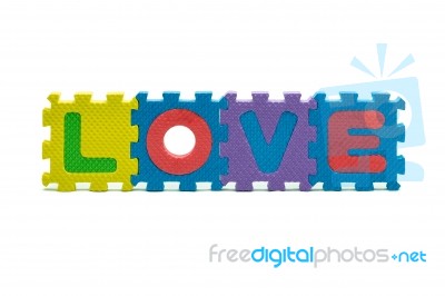 Word Love Formed With Colorful Foam Puzzle Toy Isolated On White… Stock Photo