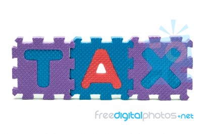Word Tax Formed With Colorful Foam Puzzle Toy Isolated On White Stock Photo