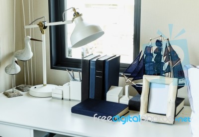 Work Table With Lamp,pencil, Books In A Home Stock Photo