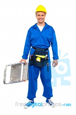Worker Carrying Stepladder Stock Photo